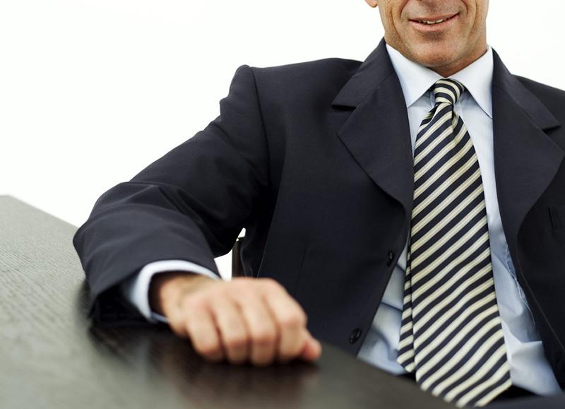 Man-in-Suit-Sitting.jpg