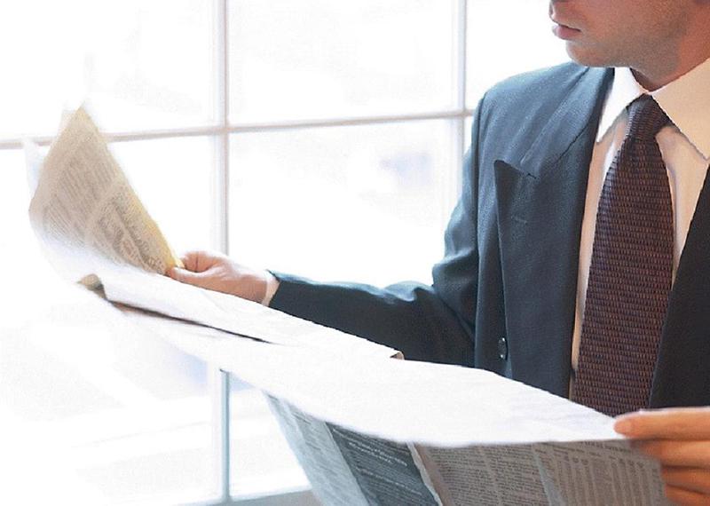 businessman-reading-newspaper.jpg