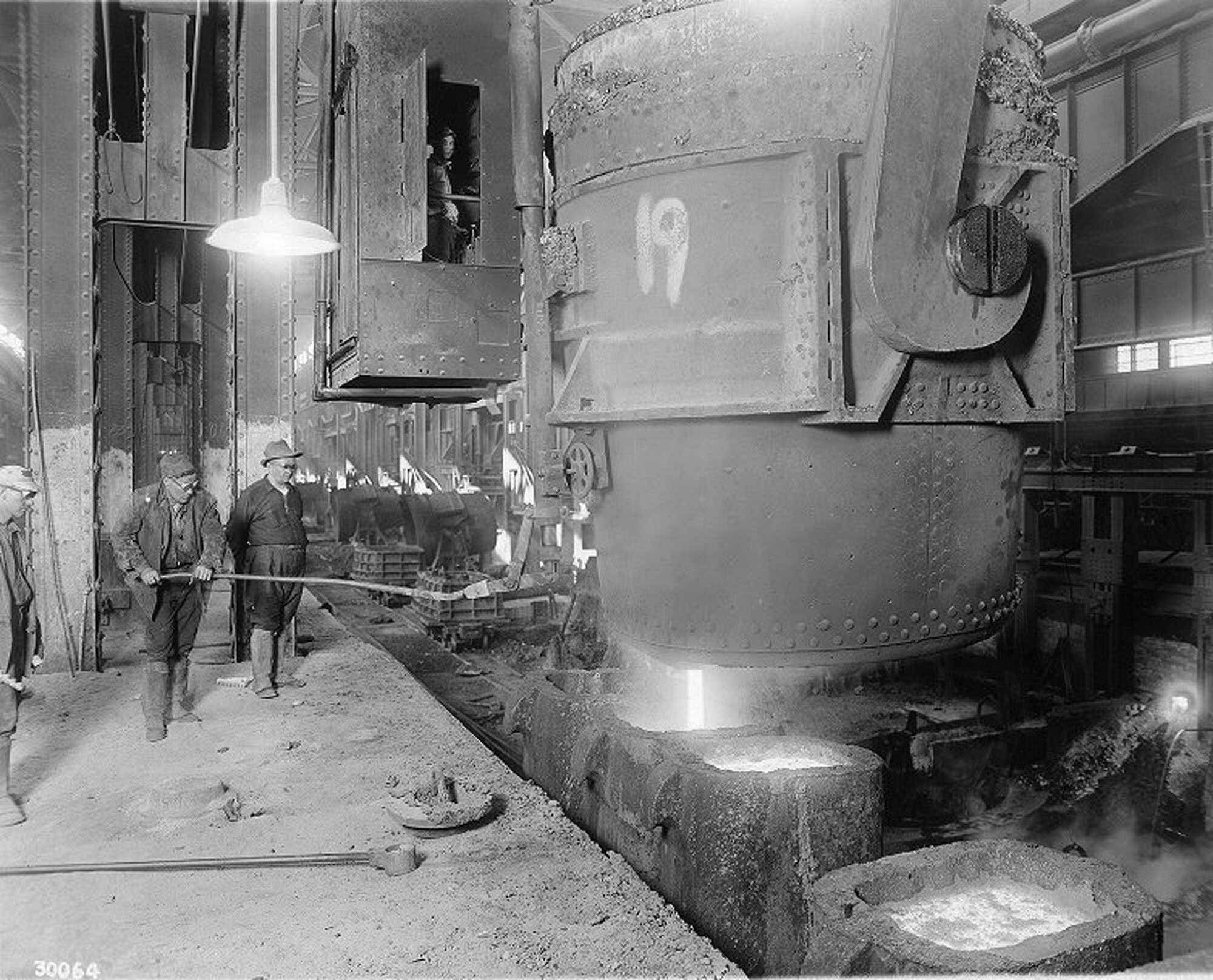 steel-workers-gaze-on-as-molten-steel-is-poured-from-ladle-to-casts-at-homestead-steel-works-december-31-1914-pd.jpg__2000x1616_q85_crop_subsampling-2_upscale.jpg